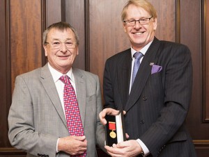 Past president Peter Hoyle (left) receives his Distinguished Service Award from B&ES chief executive Roderick Pettigrew