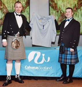 Darrel Birkett, left, presents George Pinner’s shirt to Ritchie Marshall of Cahonas Scotland