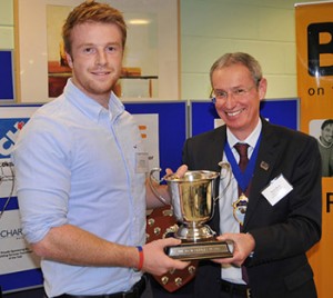 B&ES president Bruce Bisset (right) presents the David Kettles Cup to Scottish Craft Apprentice of the Year Tom Gregory of Prospero Facilities Services.